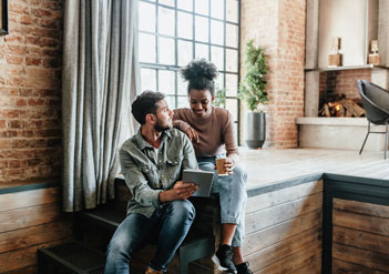 Couple looking at a tablet