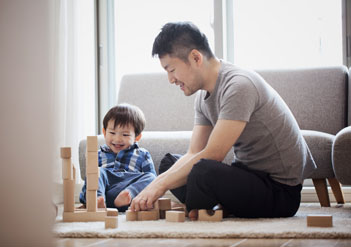 Dad and son playing with blocks