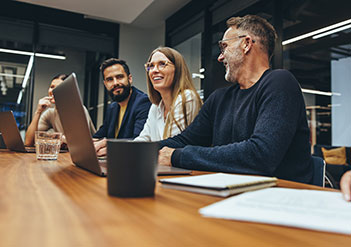 Colleagues working together in a conference room 